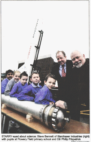 STARRY-eyed about science: Steve Bennett of Starchaser Industries (right) with pupils at Flowery Field primary school and Cllr Phillip Fitzpatrick